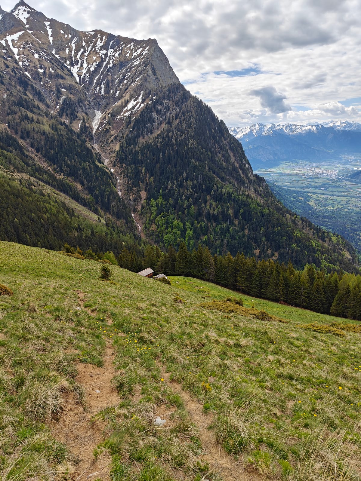 Steep trail above Matan with Falknishorn visible top left and Rhine Valley below
