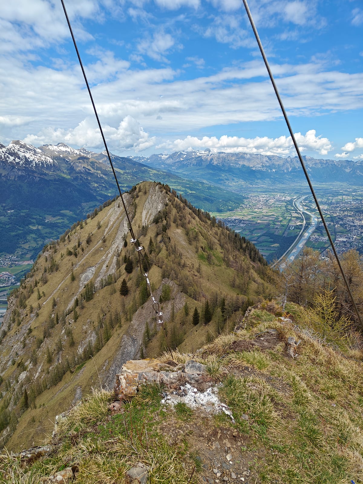Exposed ridge looking toward Mittagsspitz with fixed cable visible, Rhine Valley far below